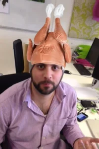 men wearing chicken hat at oktoberfest